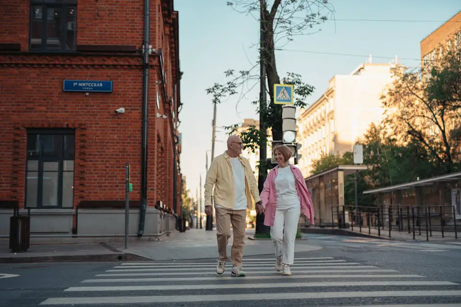 A content senior man and woman couple in their 70s walking closely together outdoors.